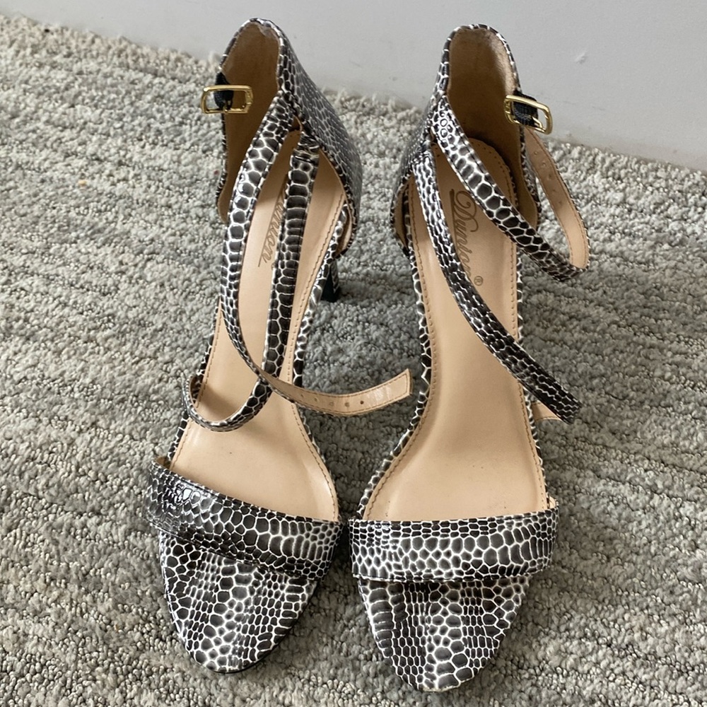 Never worn women’s Dunion Size 8 with dust bags snake skin and box.